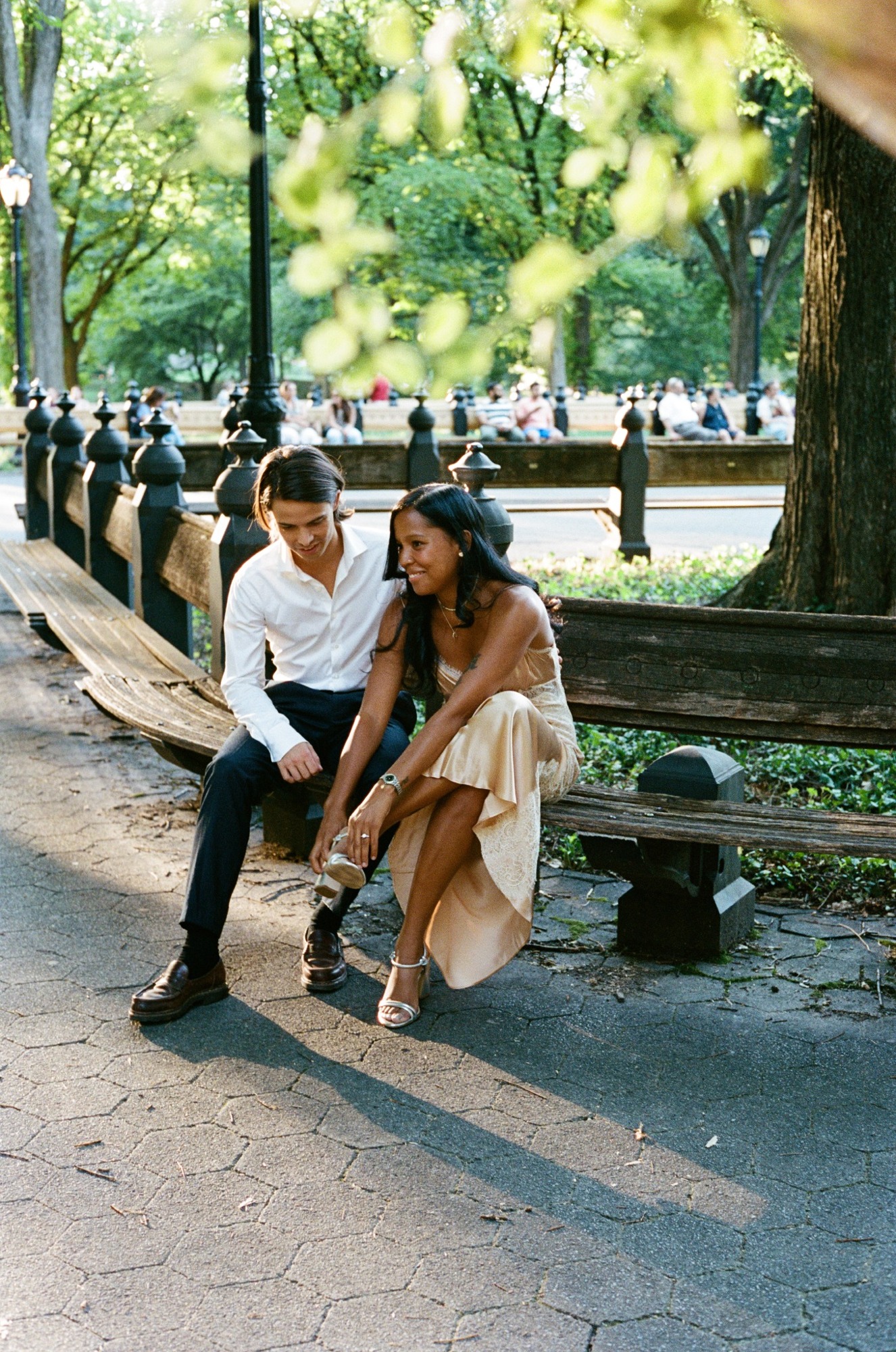 Oscar and Amber sitting together on a park bench