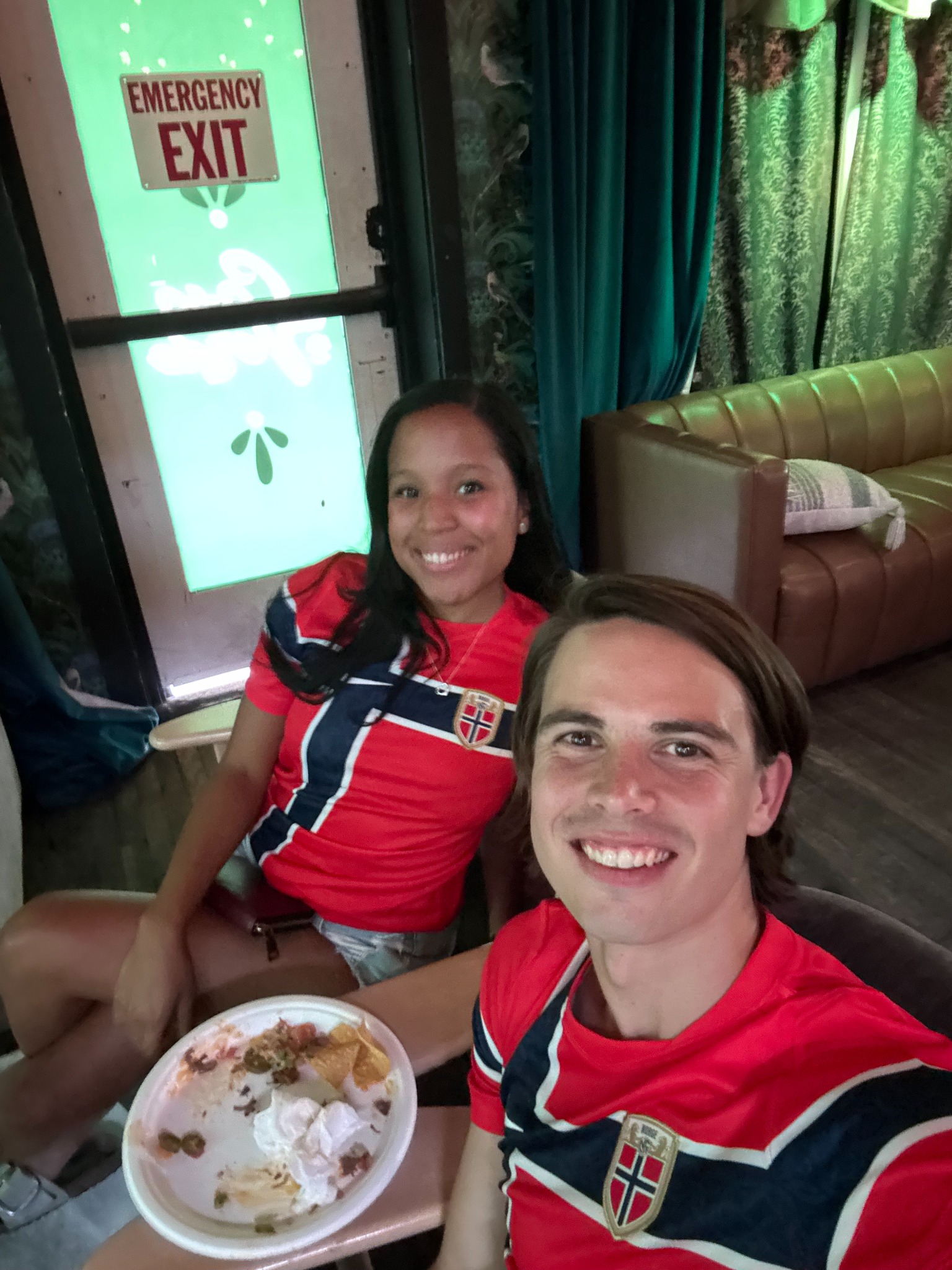 Oscar and Amber celebrating in matching jerseys