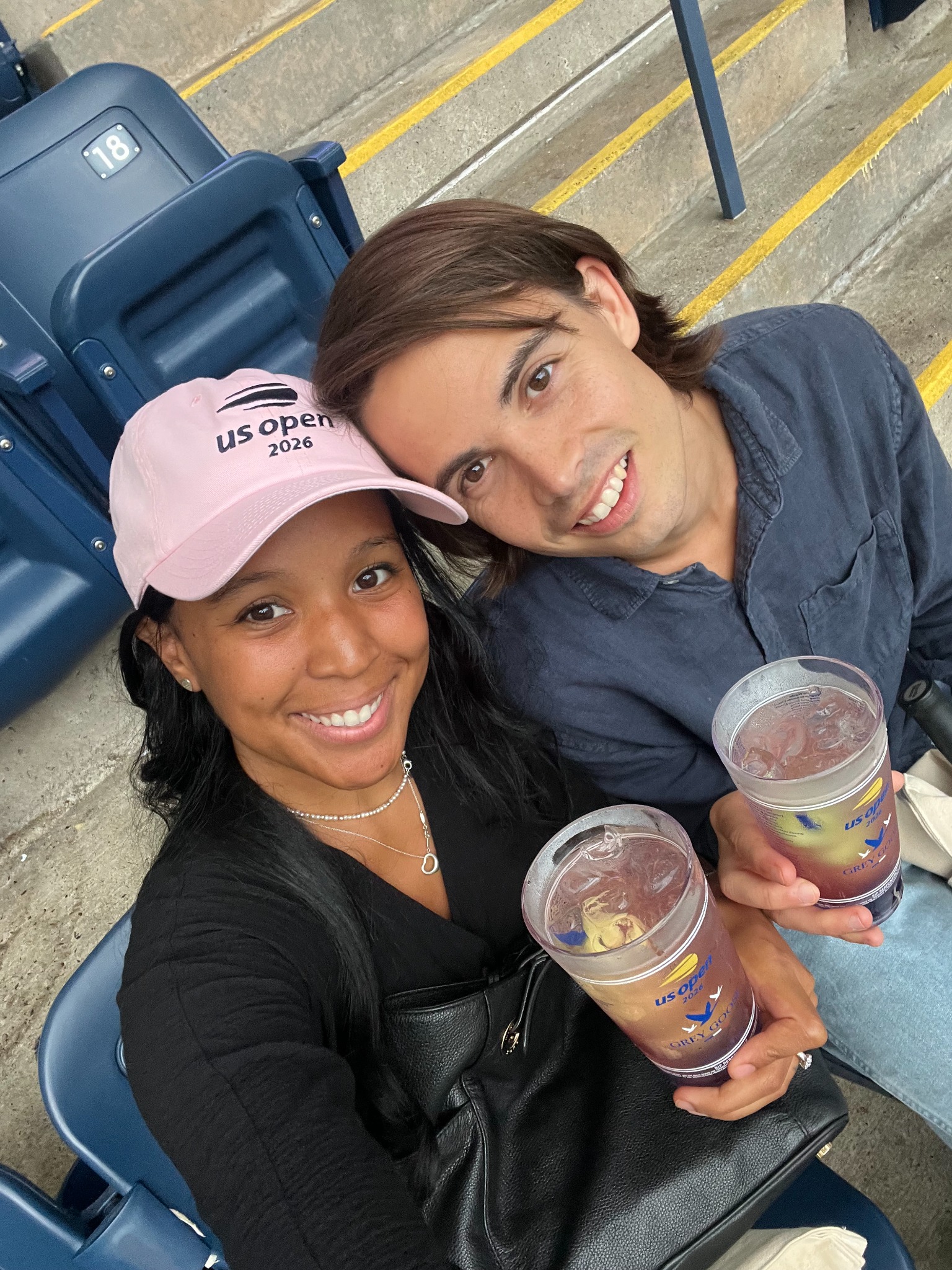 Oscar and Amber sharing a drink at the airport