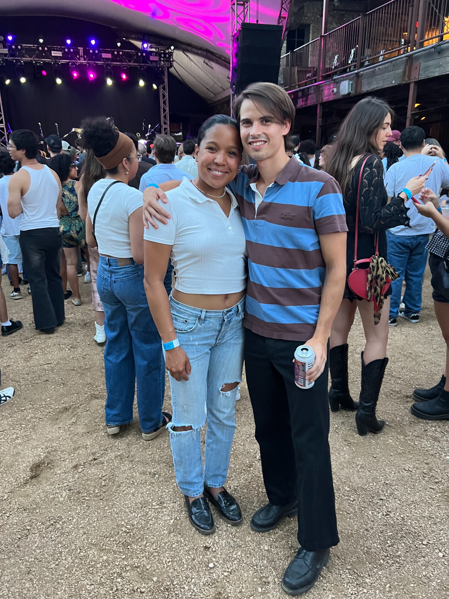 Oscar and Amber at an outdoor music event